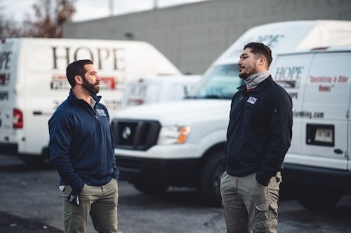 Hope Plumbing employees and trucks